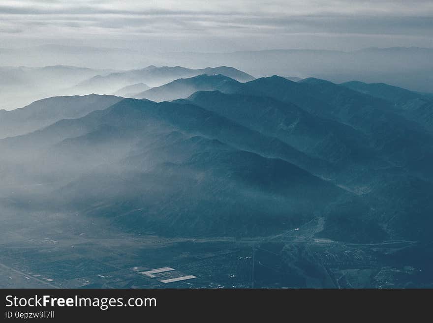 Scenic view of foggy mountainous landscape.