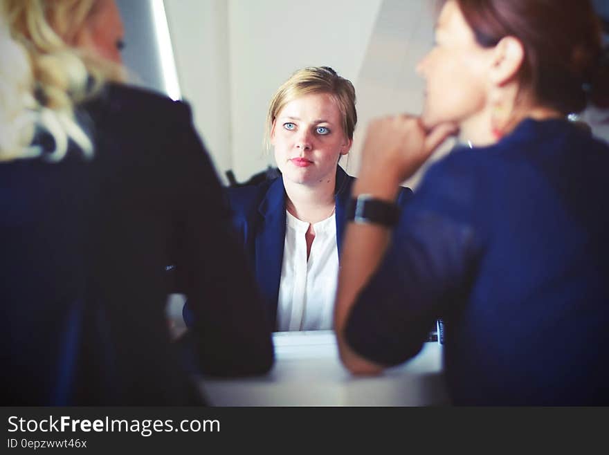 3 Women in Suit Sitting