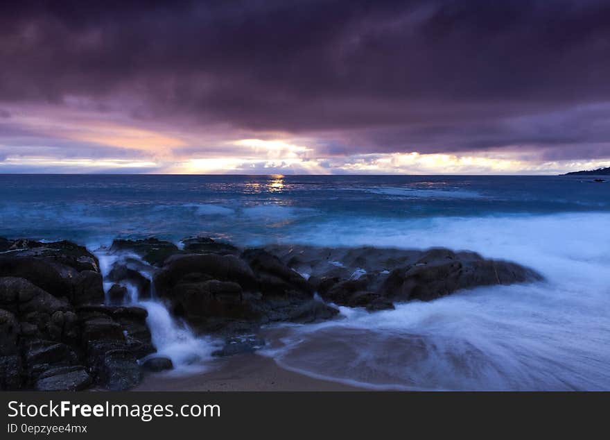 Sea Under Gray Sky during Day Time