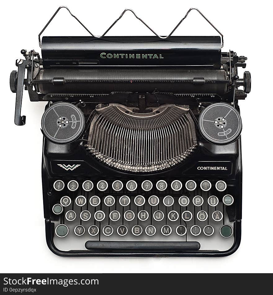 Black Continental Typewriter on White Surface