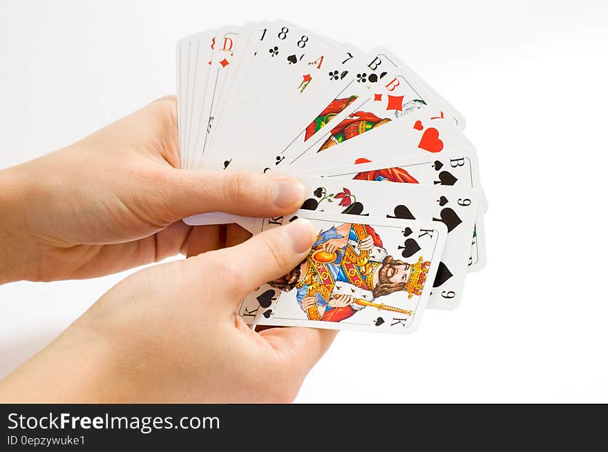 Person Holding Playing Cards