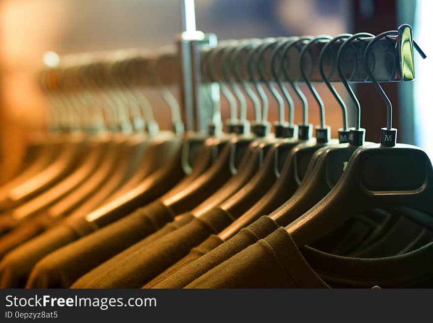 Pile of Shirts Hanged in Shirt Rack