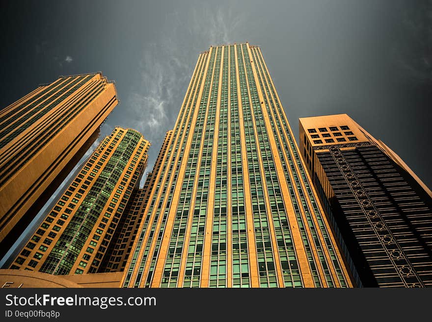 Yellow Concrete Building Under Dark Sky during Night Time