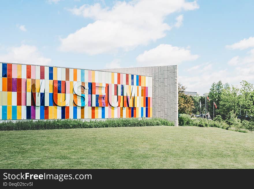 White Red and Blue Museum on Green Grass