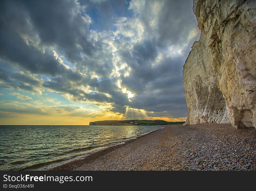 Beige and Grey Rock on the Seashore Photograph