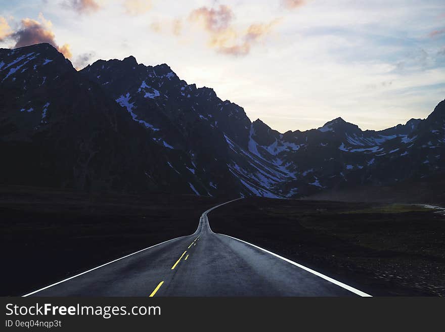 Gray Concrete Road With Mountain Ahead