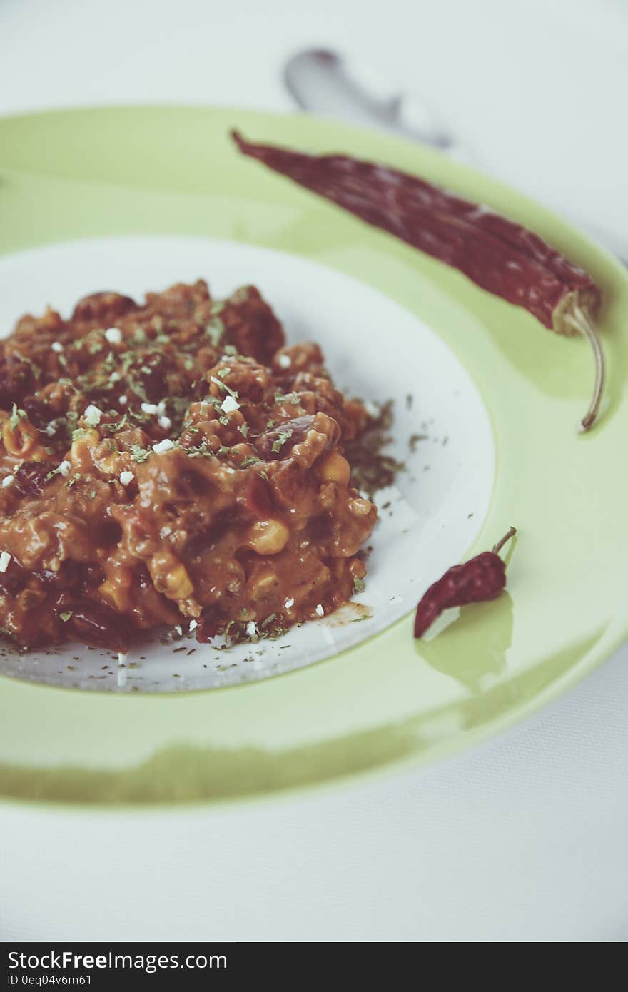 Cooked Food in White and Green Ceramic Round Plate