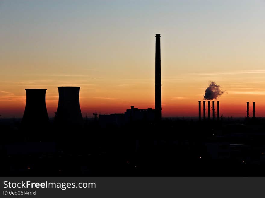 Silhouette Photo of Factory during Dusk