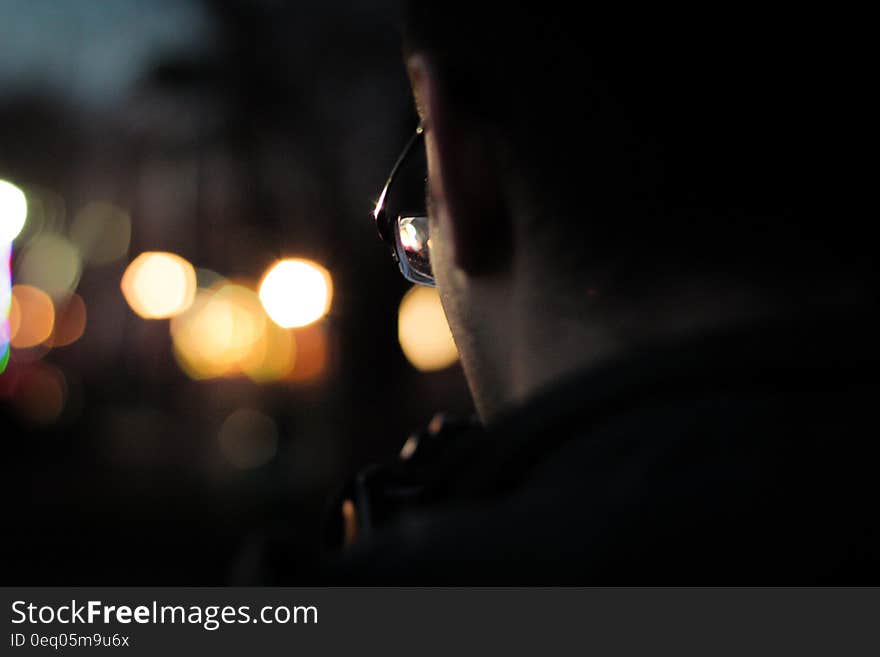 Man Wearing Black Framed Eyeglasses in Macro Photography