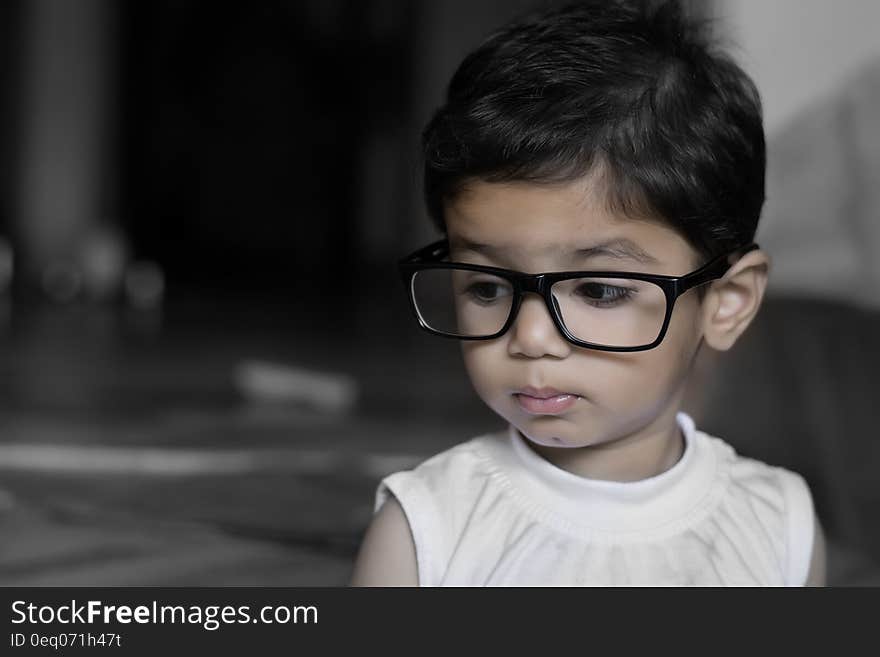 Portrait of young girl indoors wearing glasses. Portrait of young girl indoors wearing glasses.