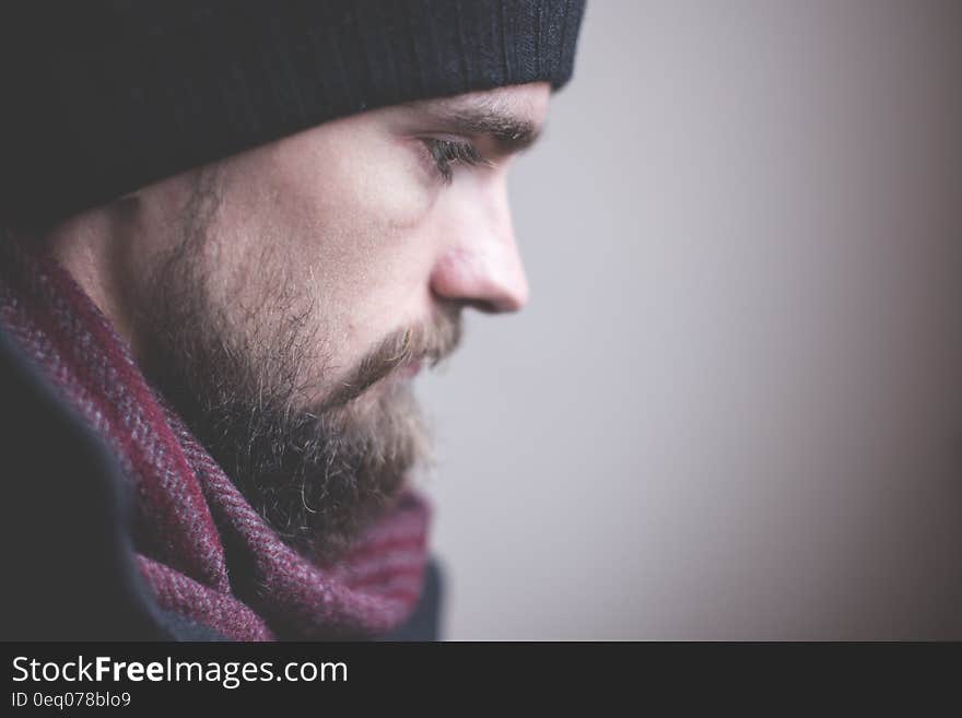 Man in Red Scarf and Black Nit Hat