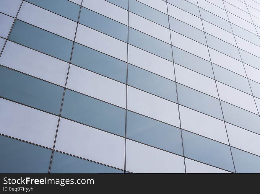 The facade of a modern skyscraper building. The facade of a modern skyscraper building.