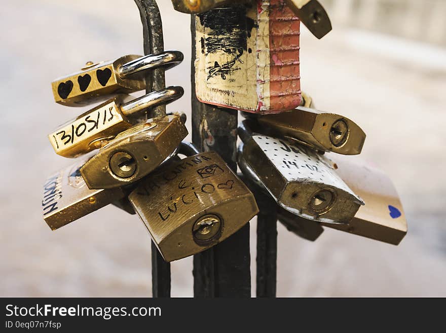 Brass Padlock on Black Metal Stand