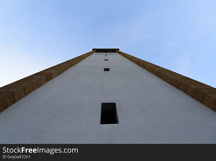 White and Black Concrete Building during Day Time