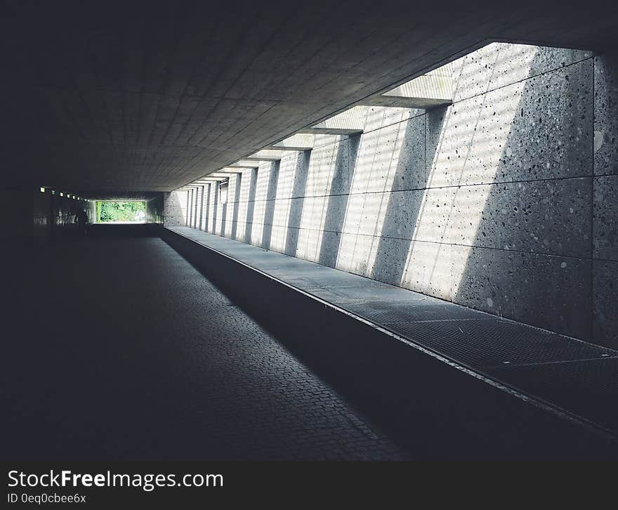 Sunlight Streaming Through Concrete Opening of Underground Passageway