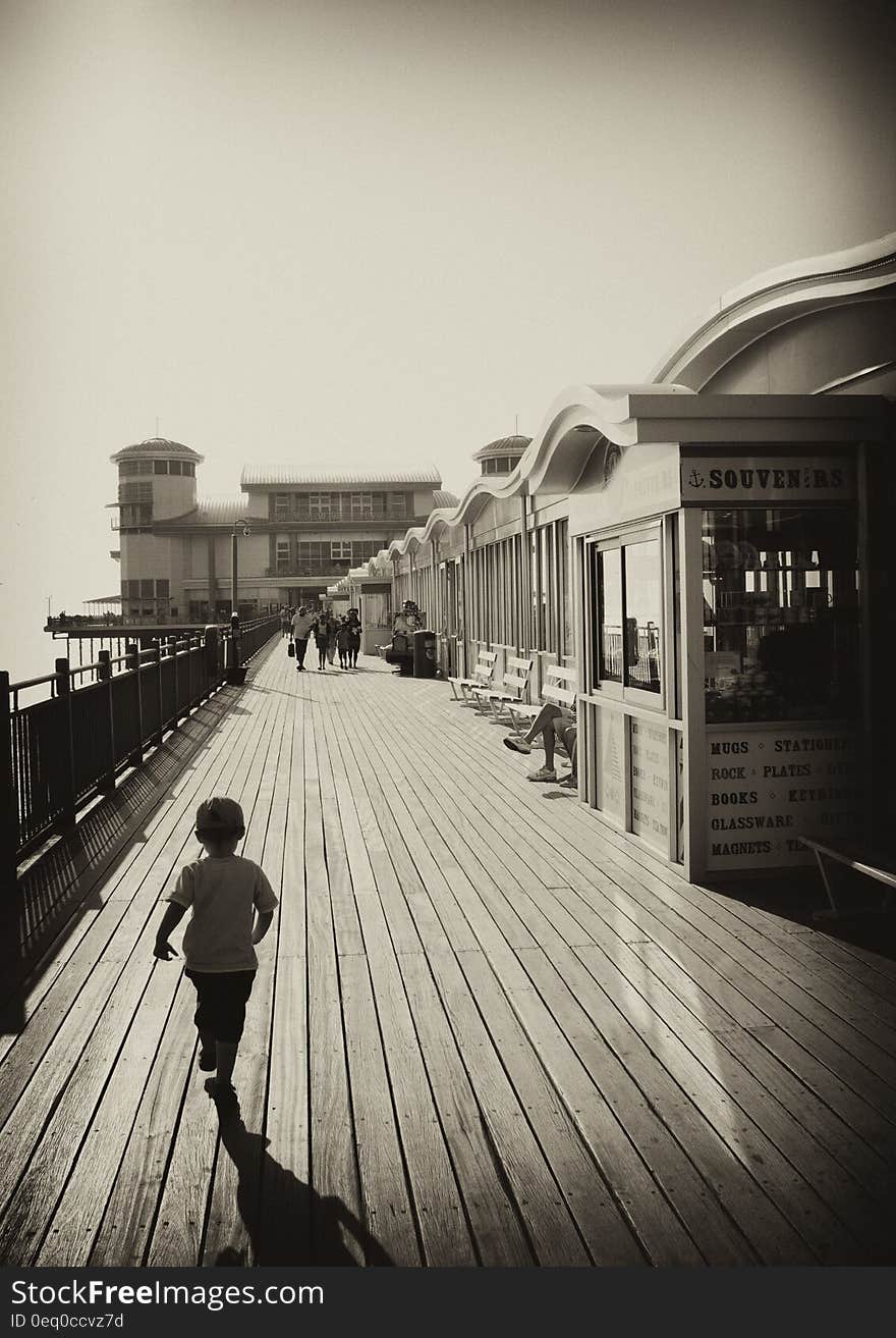 Boy Near Booth Standing at Daytime