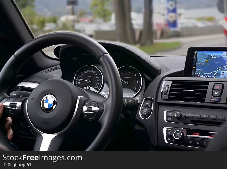 The dashboard and the steering wheel of a modern car. The dashboard and the steering wheel of a modern car.