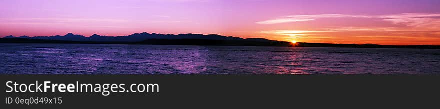 Panorama of hills along coastline at sunset. Panorama of hills along coastline at sunset.