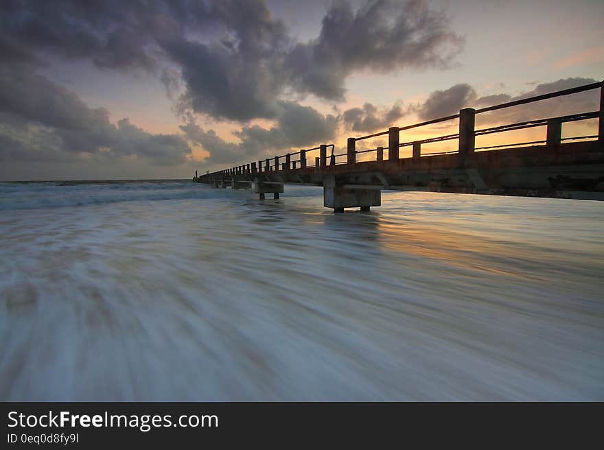 Brown Wooden Fishing Dock on Ocean