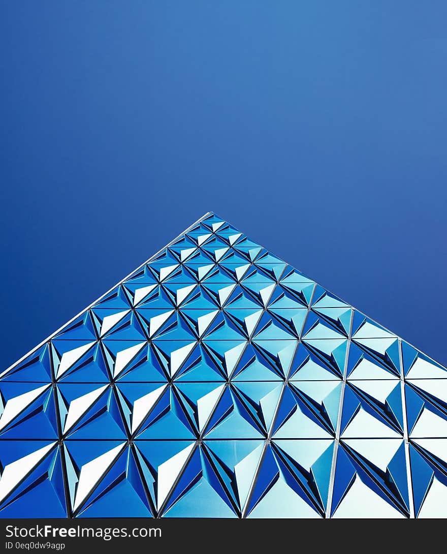 Exterior of geometric patterned blue building with sky background, Toronto, Canada. Exterior of geometric patterned blue building with sky background, Toronto, Canada
