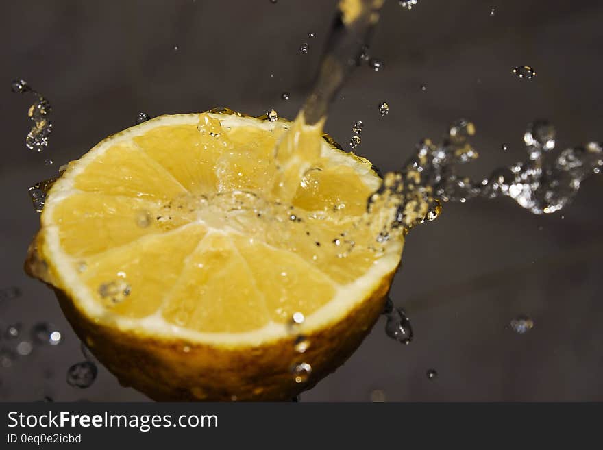 A lemon half in the water. A lemon half in the water.