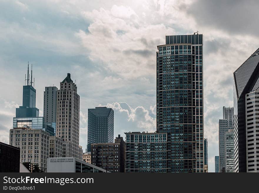 A city view with modern houses and skyscrapers. A city view with modern houses and skyscrapers.