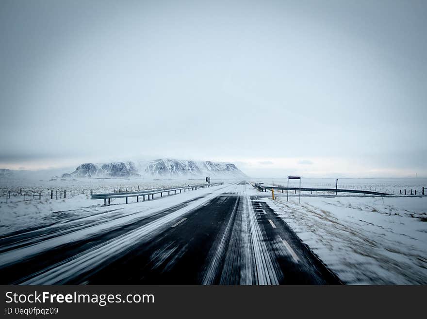 Winter landscape with a road passing through. Winter landscape with a road passing through.