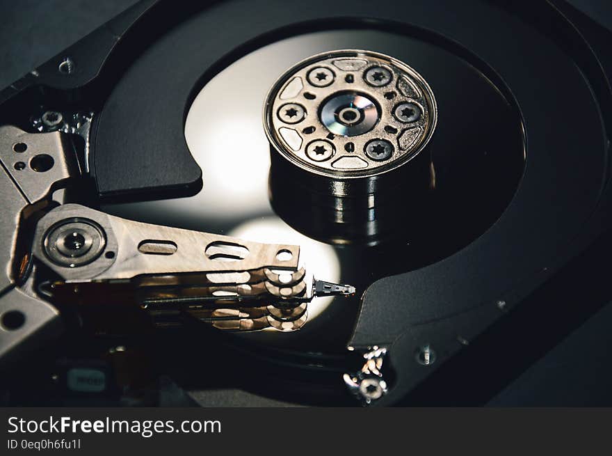 Close up of mechanism inside computer hard drive.