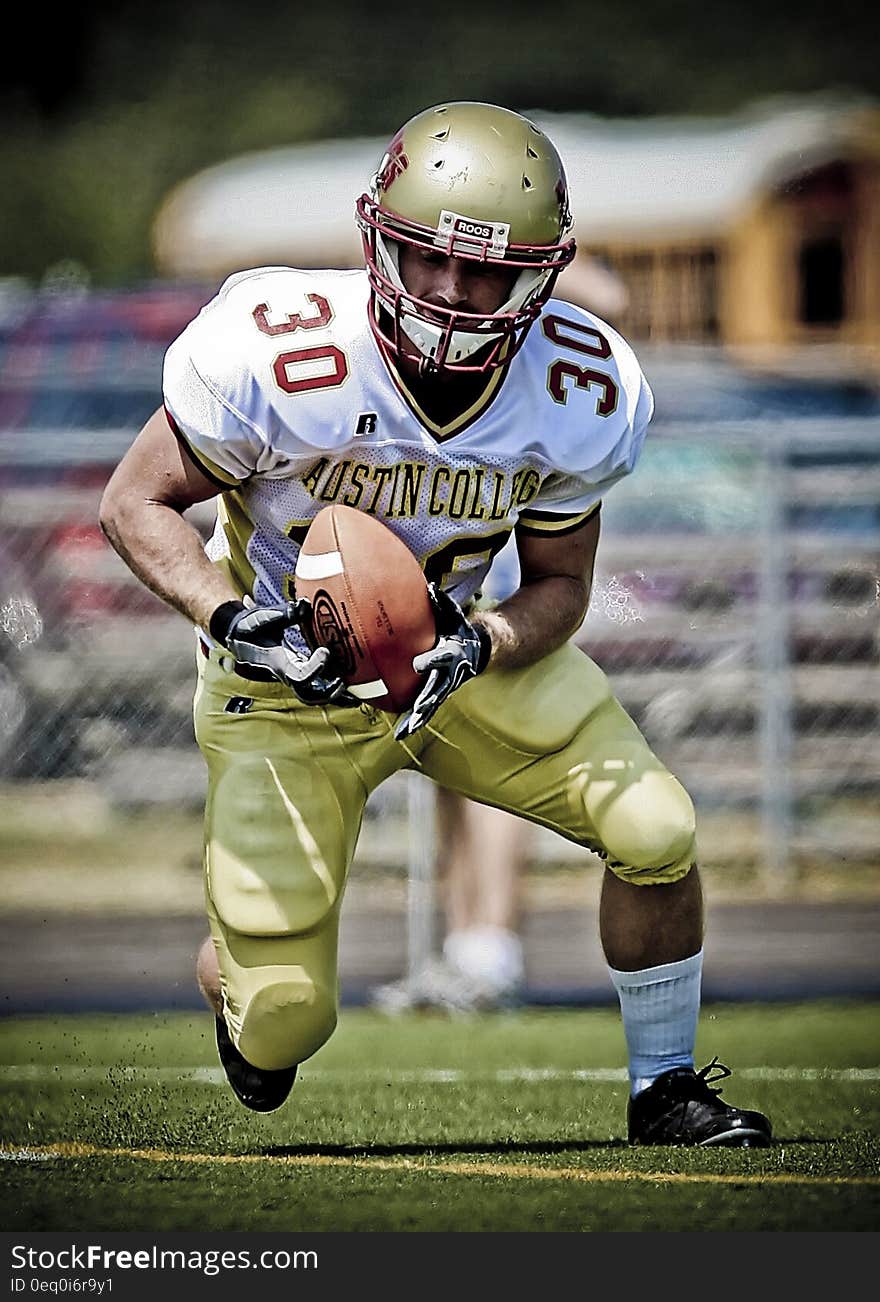 Austin College Football Player Running With Football