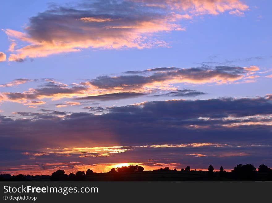 White Clouds and Blue Sky during Golden Hour