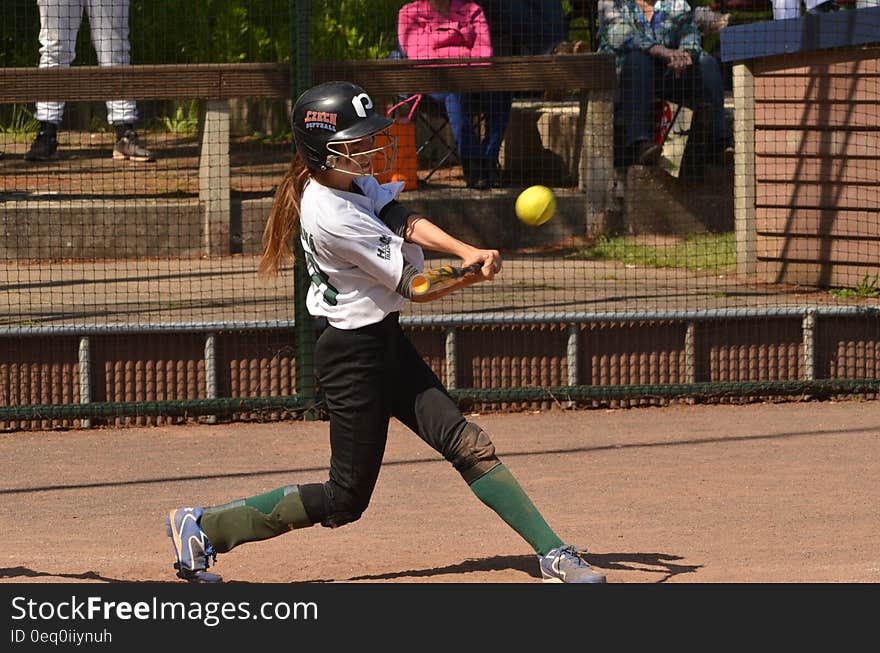 Woman Baseball Player Holding Brown Bat