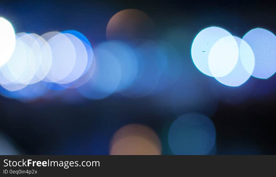 Round Faded Lights during Nighttime