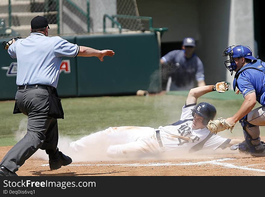 Man With White T Shirt Running to Baseball Home