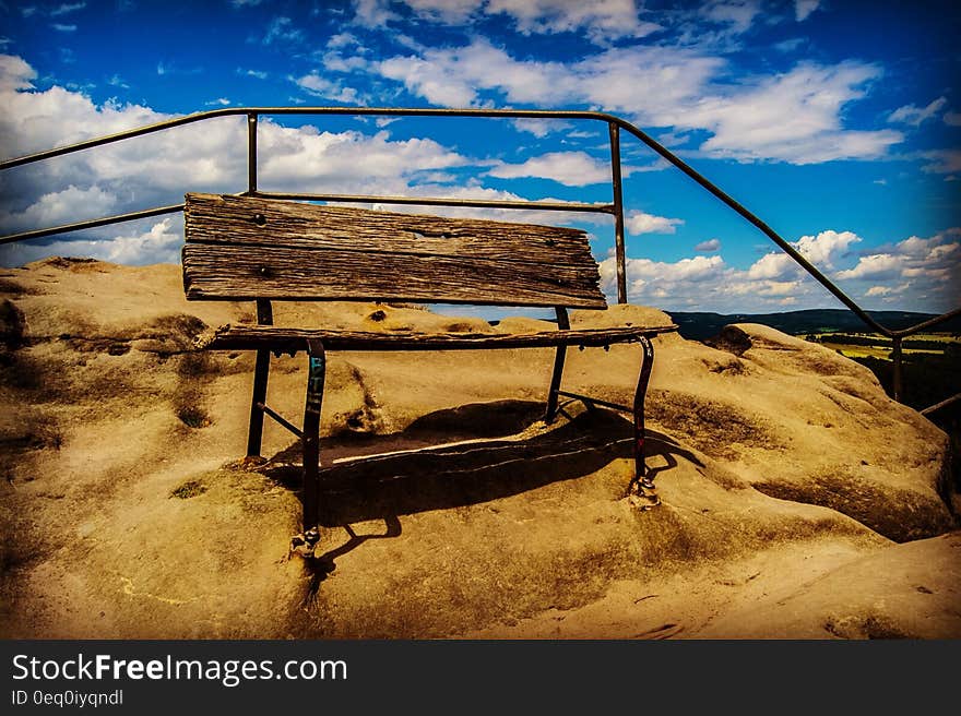 Brown Wooden Bench on Brown Sand