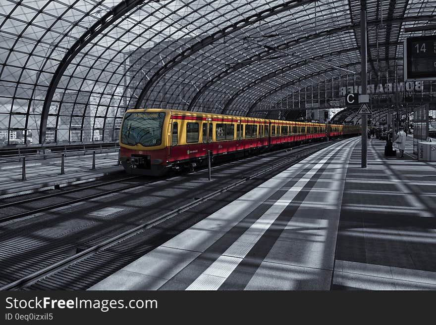 Yellow Train on Railway during Daytime