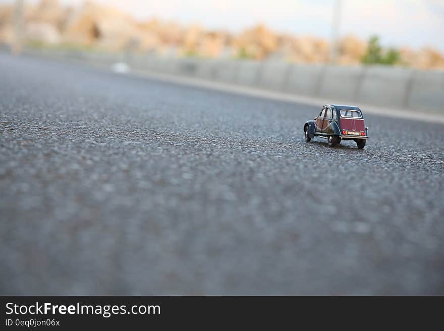 Citroen toy car on pavement on sunny day. Citroen toy car on pavement on sunny day.