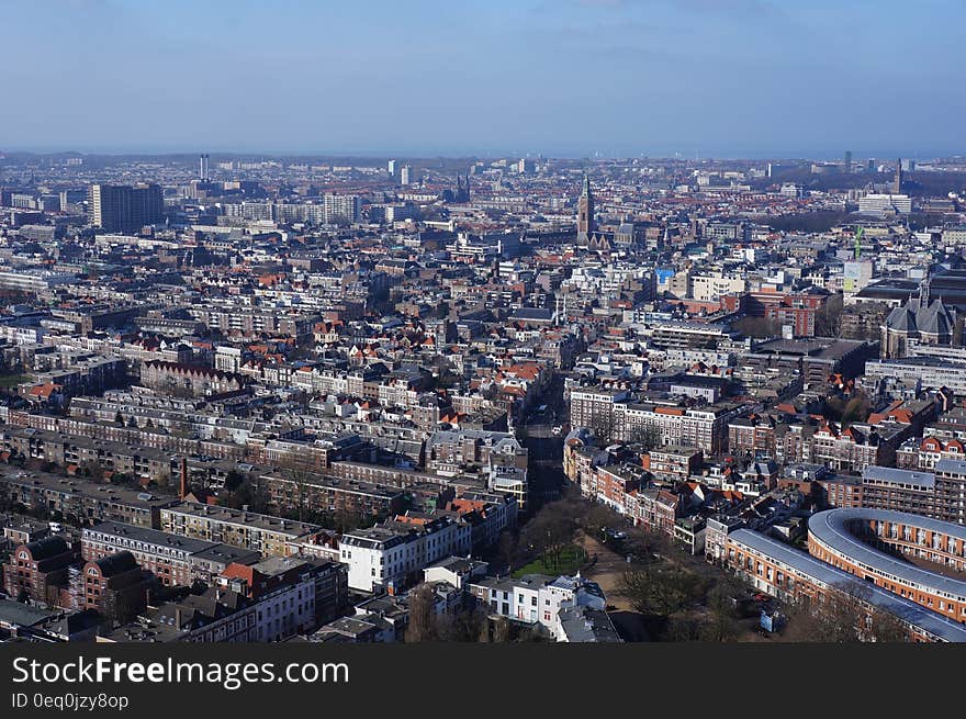 Aerial View of the City Under Blue and White Cloudy Sky