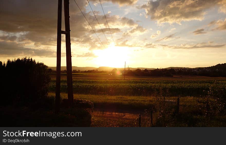 Green Field Landscape Photo during Sunrise