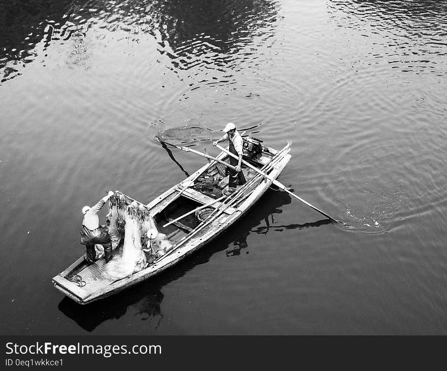 Man in White Boat