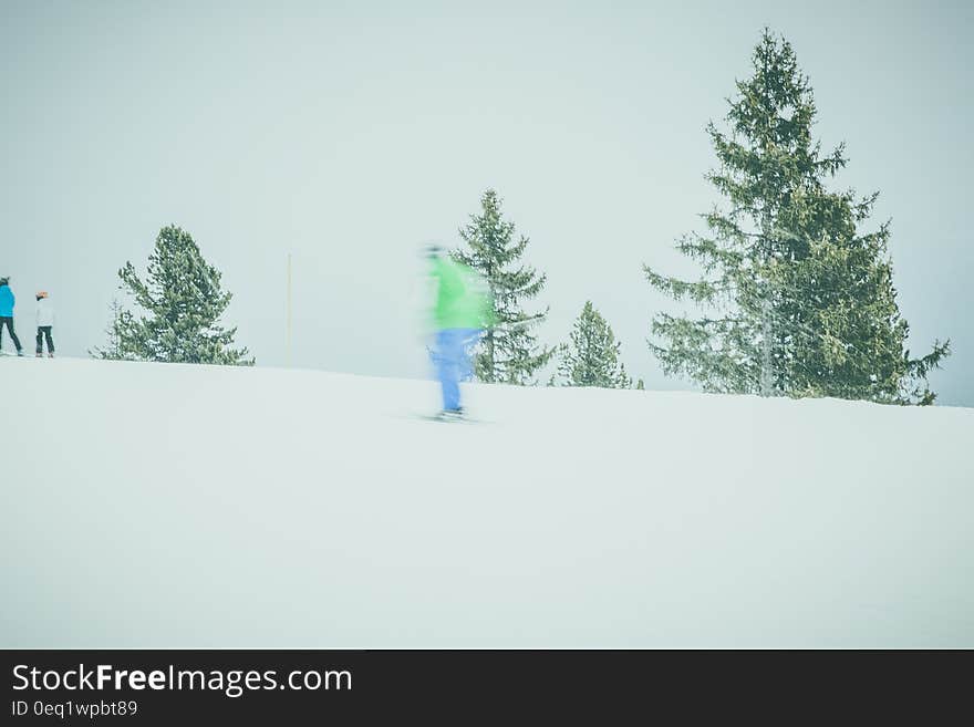 Human in Blue Pants Riding Ski Board