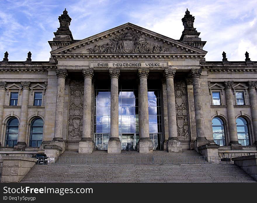 Columns on staircase outside Parliament Building in Berlin, Germany against blue skies. Columns on staircase outside Parliament Building in Berlin, Germany against blue skies.