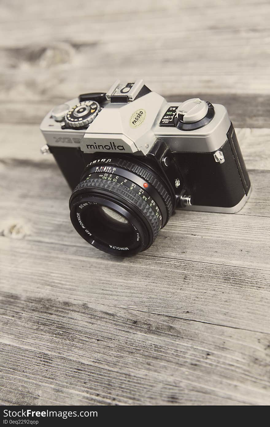 Minolta Camera on Wooden Surface