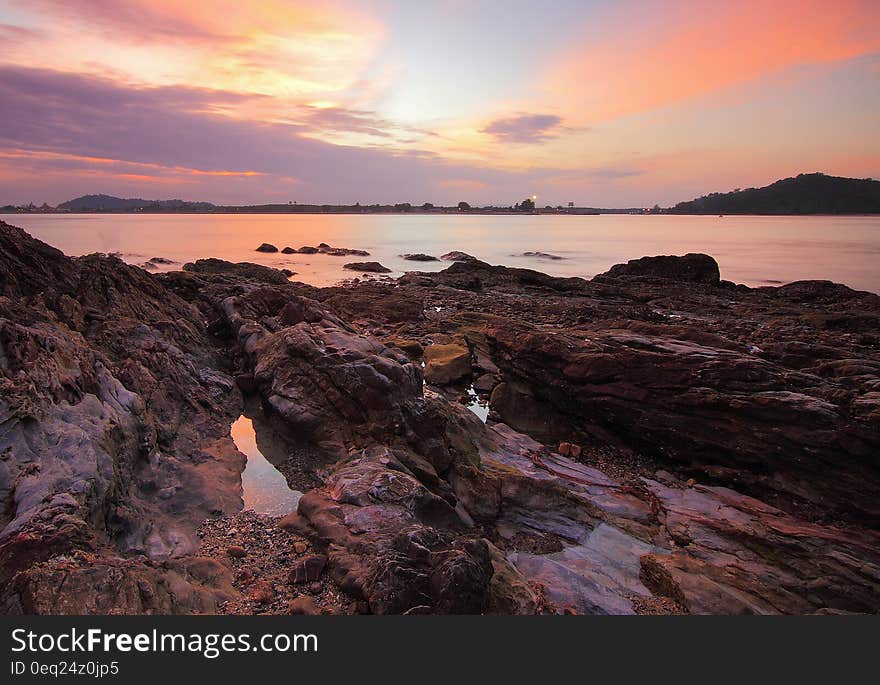 Rocks along coastline at dawn. Rocks along coastline at dawn.