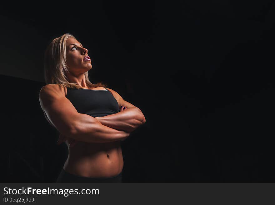 A young woman bodybuilder in fitness outfit.