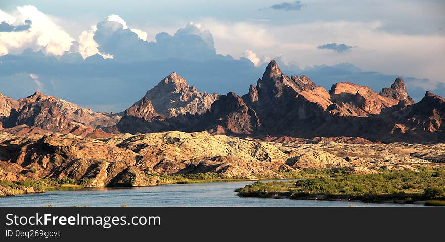 Mountains and River during Daytime