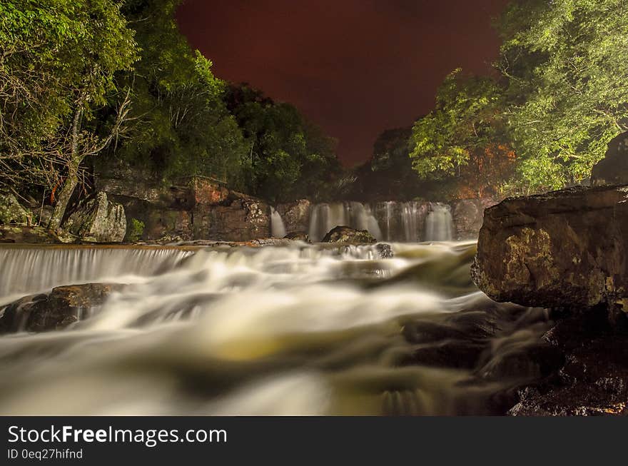 Green Leaf Trees Near the Flowing Water Fall