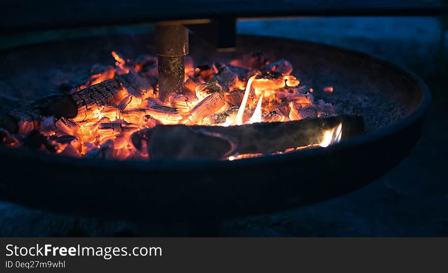 Round Fire Pit With Burning Wood