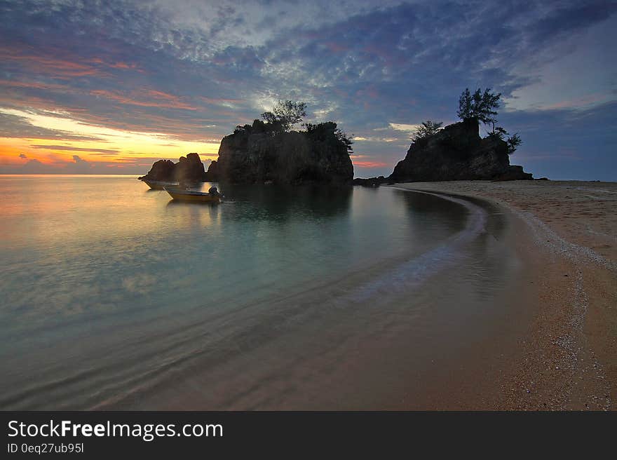 Seashore during Sunrise Photo