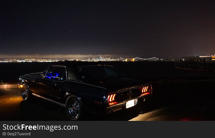 Black Coupe During Evening