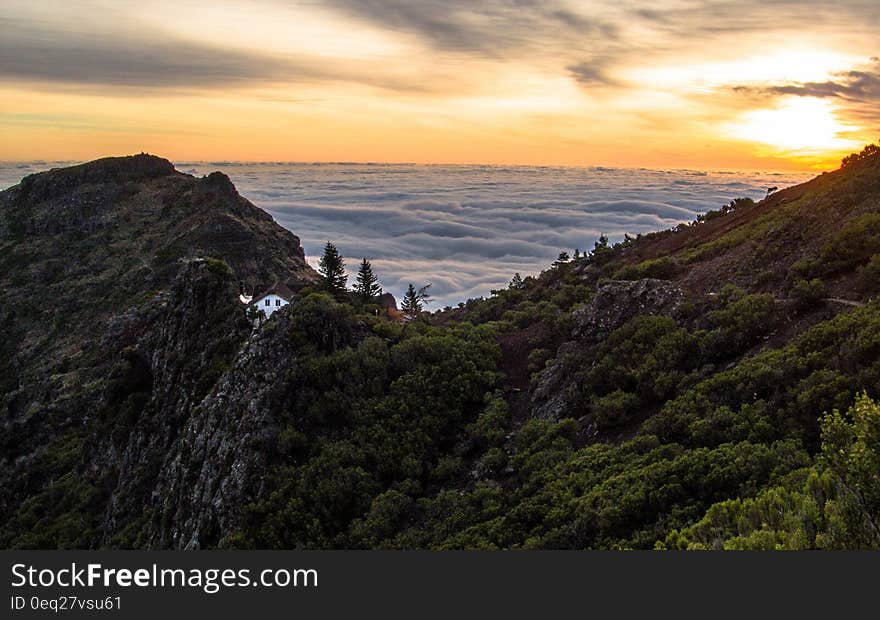 Mountain Above White Clouds during Sunset